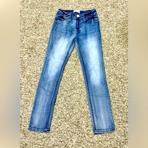 Girls freestyle, skinny jeans. Never worn. Zip up, snap closure. Size 8.